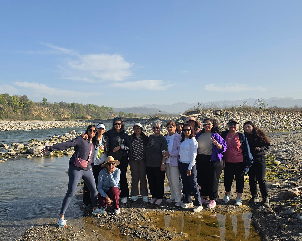 Group Enjoying a Riverside Experience in Jim Corbett